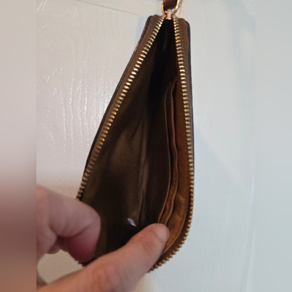 Celebrate the season with this stylish Coach wristlet wallet featuring a winter- - Picture 3 of 3